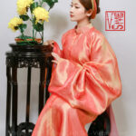 Thuê việt phục áo tấc cam san hô lót hồng Vstyle